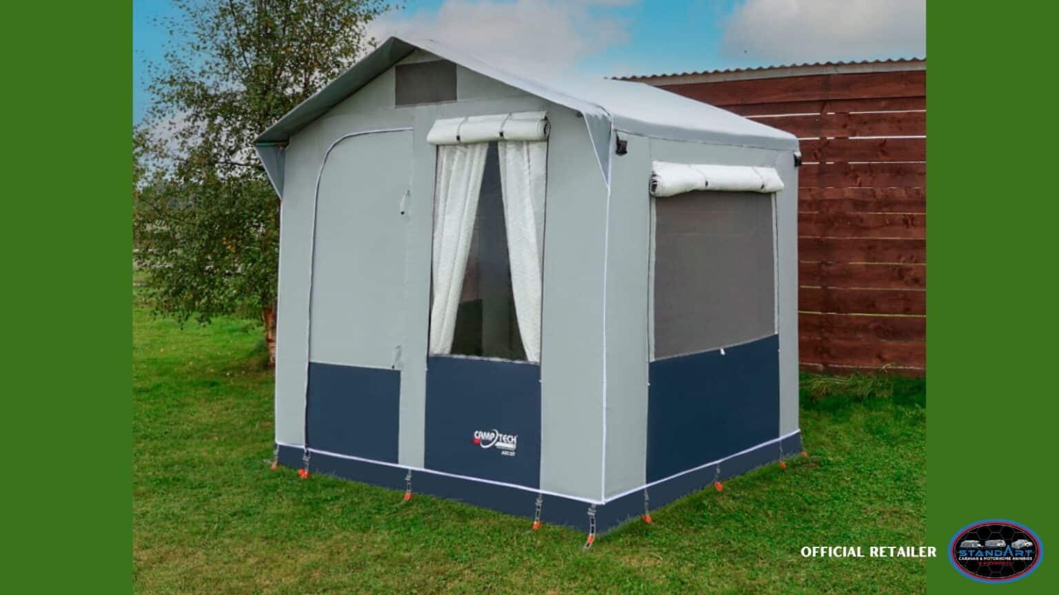 A small tent in the middle of a field.