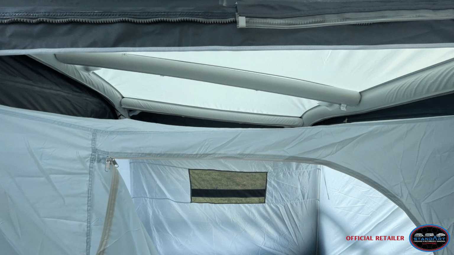 A tent with a window and a roof.