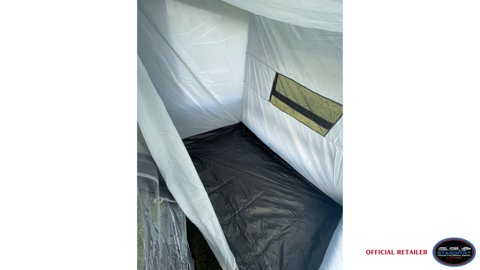 A tent with a black sheet on the bottom.