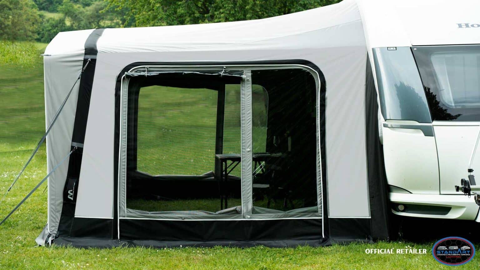 A tent with a window open and a door opened.