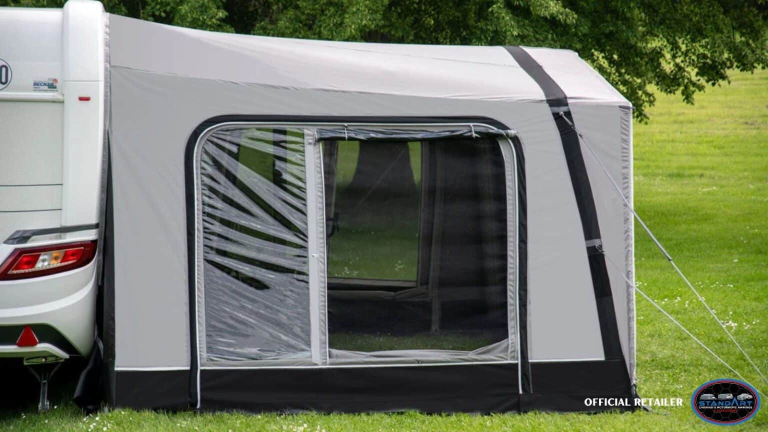 A white and black tent with a palm tree on it.