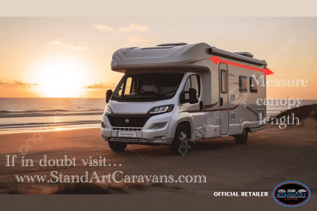 A silver motorhome parked on the beach.