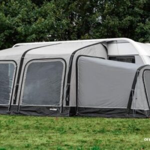 Gray caravan awning on grassy area.