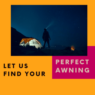 A person standing next to a tent at night.