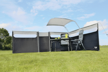 A group of three black fences inWestfield Windshield Pro Expert Edition Windbreak on a grass pitch with accessories